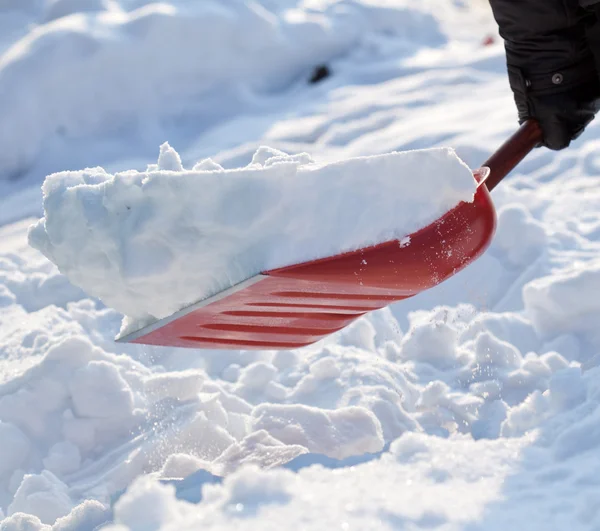 Person removing snow — Stock Photo, Image