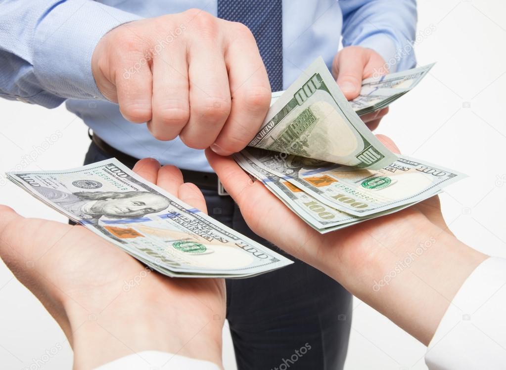 Hands exchanging money