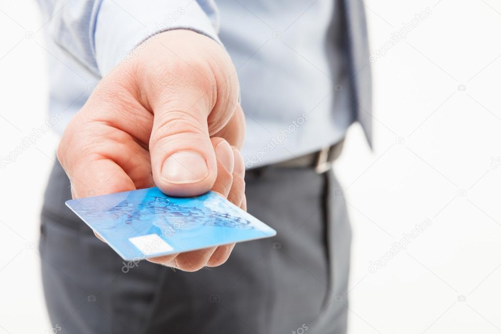 Hand giving credit card
