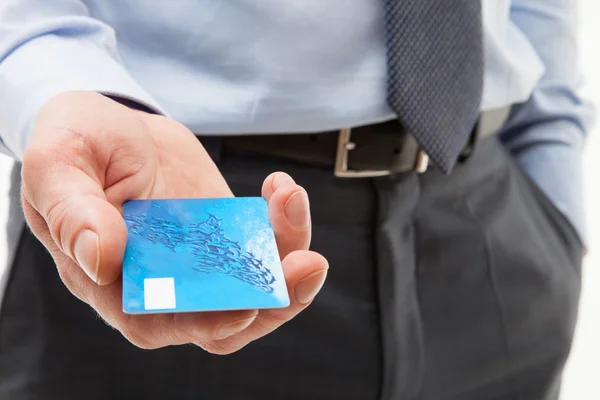 Hand giving credit card — Stock Photo, Image