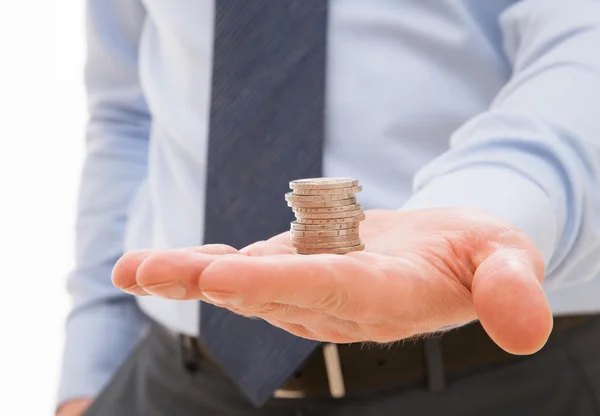 Businessman holding coins — Stock Photo, Image