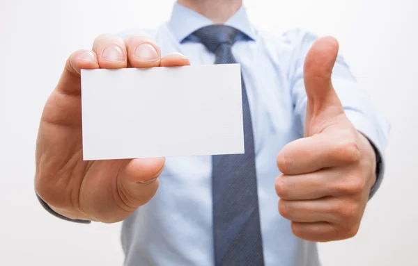 Businessman showing visiting and thumb up sign — Stock Photo, Image