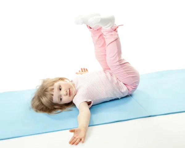 Child doing sport exercises — Stock Photo, Image