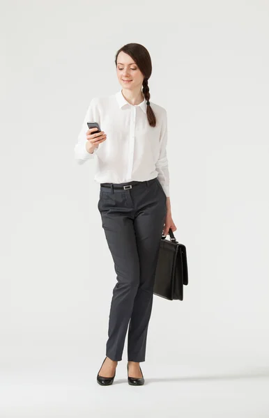 Businesswoman holding a mobile phone — Stock Photo, Image