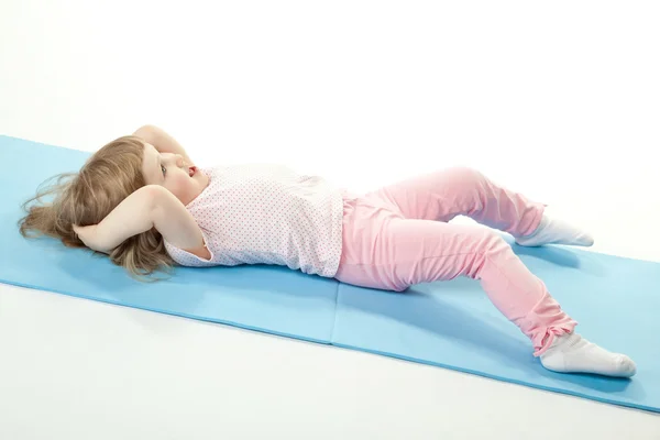 Child doing sport exercises — Stock Photo, Image