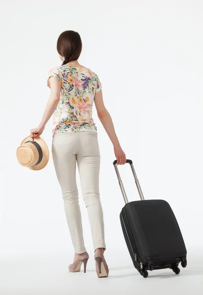 Woman with suitcase going away — Stock Photo, Image