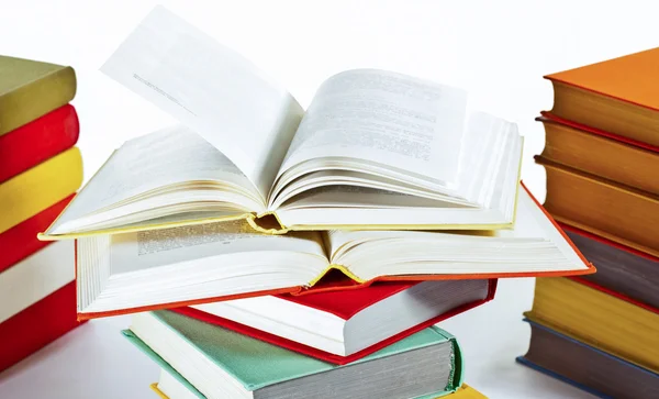 Opened and closed stacked books — Stock Photo, Image