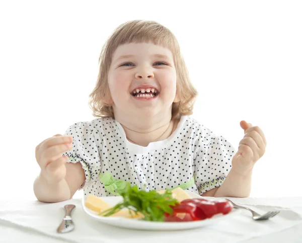 Смешная маленькая девочка ест — стоковое фото