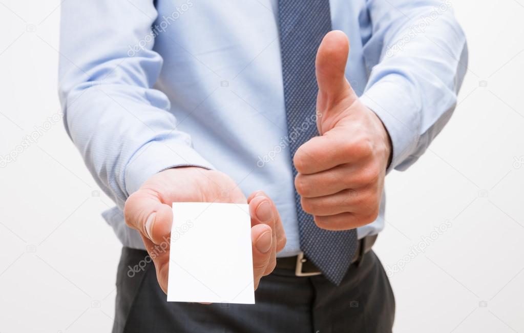 Businessman showing visiting and thumb up sign