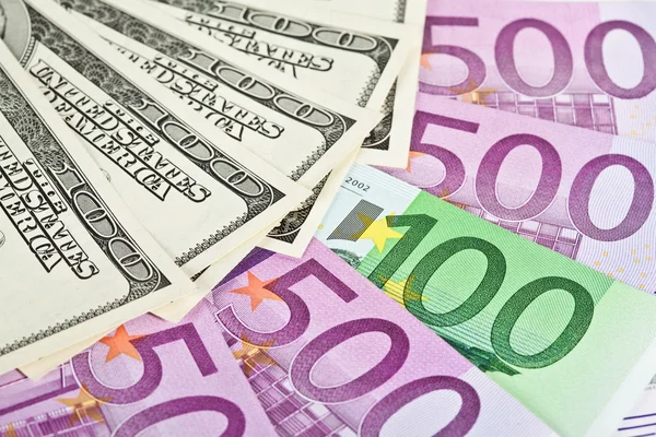 Euro och dollar sedlar och mynt — Stockfoto