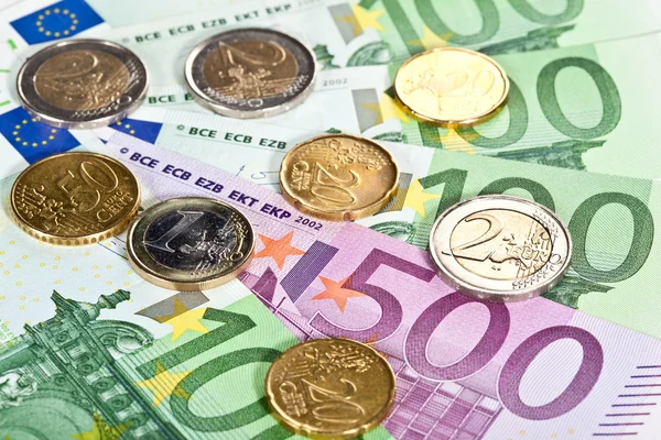 Euro banknotes and coins — Stock Photo, Image