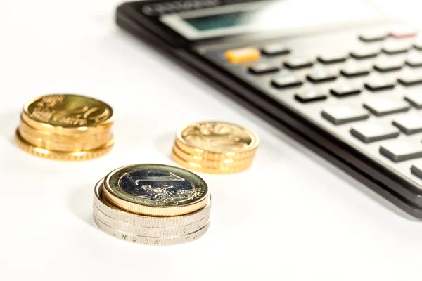 Euro coins and calculator — Stock Photo, Image