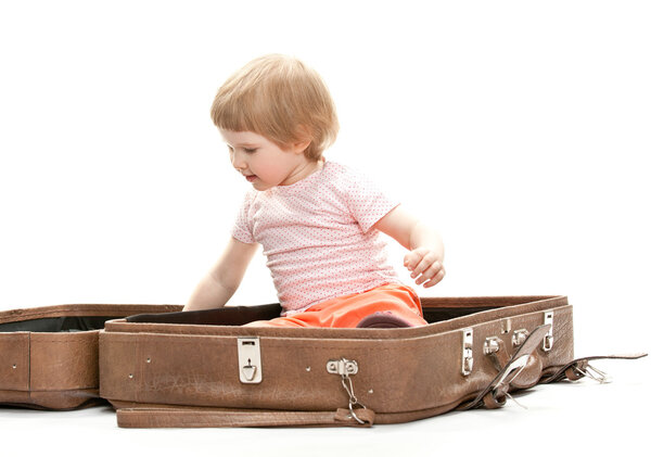 Child inside a big suitcase