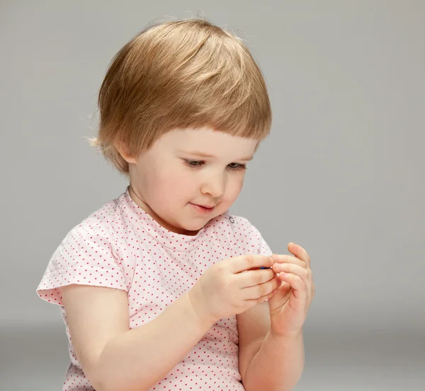 Girl playing with a toy — Stock Photo, Image