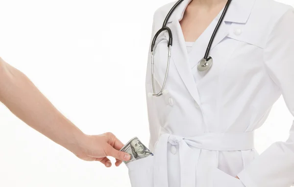 Patient's hand giving a bribe doctor — Stock Photo, Image