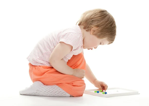 Girl playing with mosaic — Stock Photo, Image