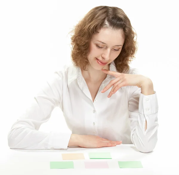 Woman looking at notes — Stock Photo, Image