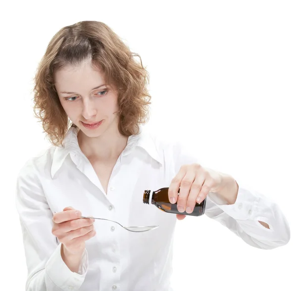 Woman pouring out syrup — Stock Photo, Image