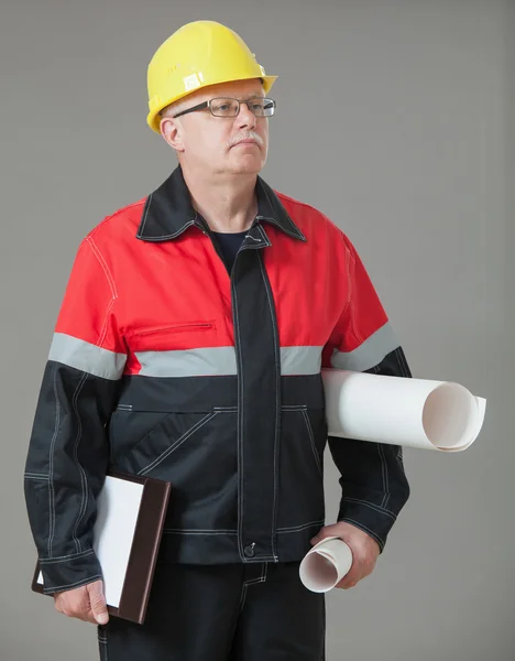 Builder holding documents and projects — Stock Photo, Image