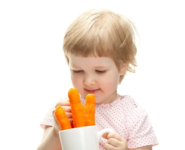 Menina comer cenouras — Fotografia de Stock