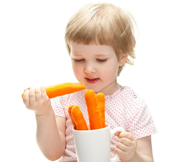 Girl eating carrot — Stock Photo, Image