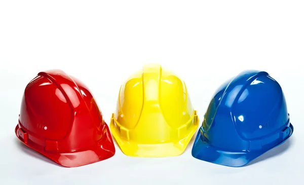 Cappelli rigidi da costruzione multicolore — Foto Stock