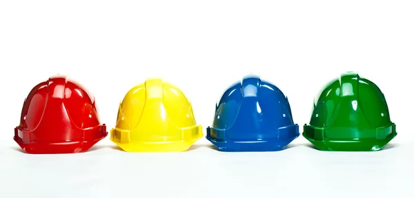 色とりどりの建設 hardhats — ストック写真