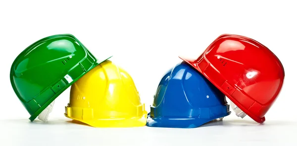 色とりどりの建設 hardhats — ストック写真