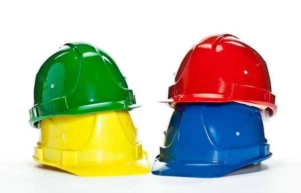 色とりどりの建設 hardhats — ストック写真