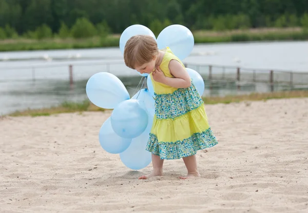 Girl walking with balloons