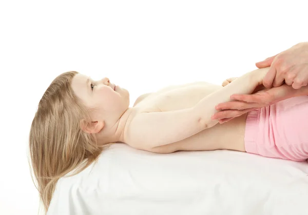 Massaging lying child — Stock Photo, Image
