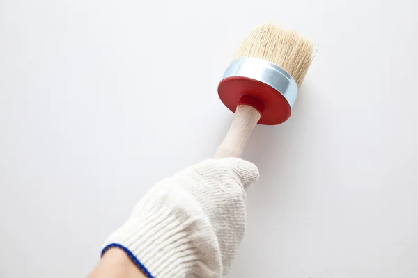 Hand måla en vägg — Stockfoto