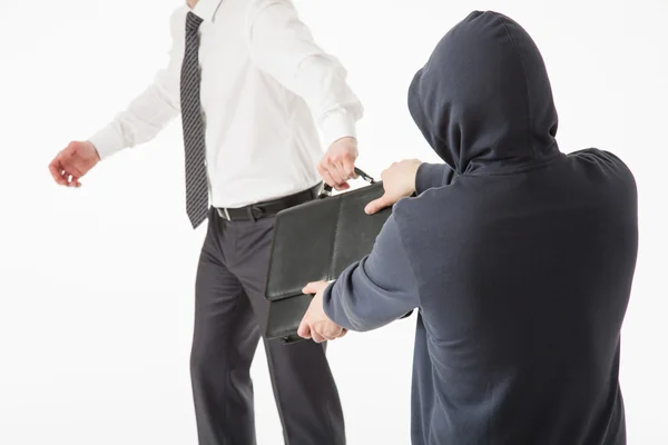 Man take away a businessman's briefcase — Stock Photo, Image