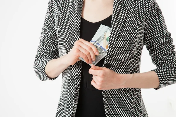 Businesswoman hiding money — Stock Photo, Image