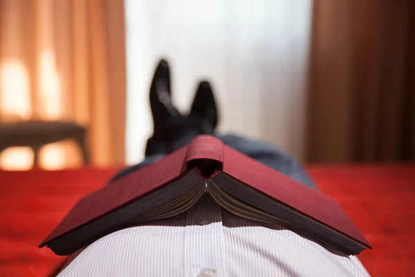 Gentleman lying on the bed