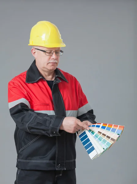 Builder choosing colors — Stock Photo, Image