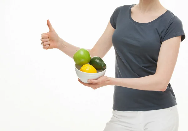 Woman holding fruits and showing thub up sign — Stock Photo, Image