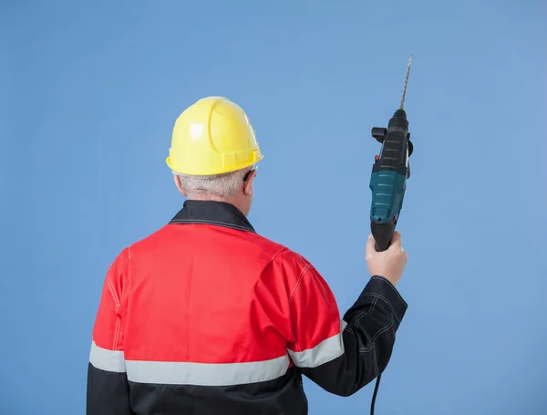 Builder holding a drill — Stock Photo, Image