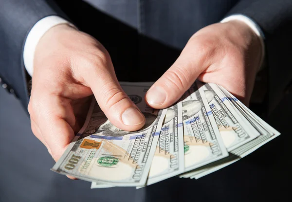 Man's hands holding dollars — Stock Photo, Image