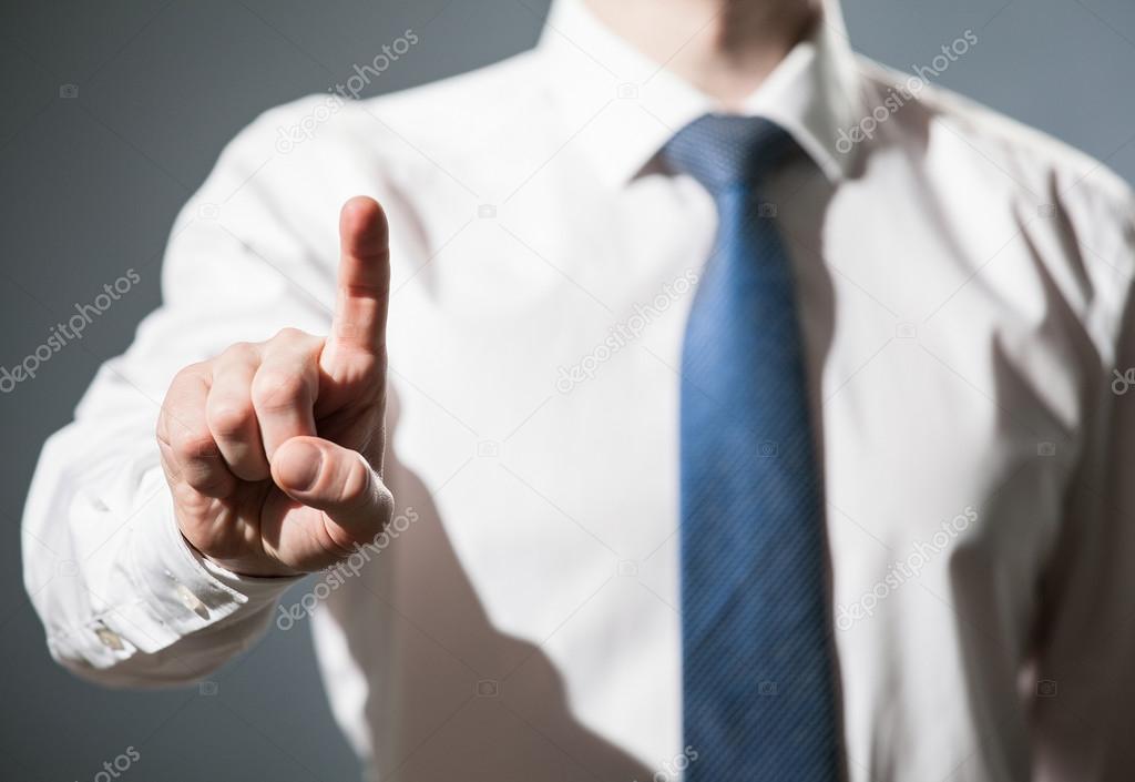 Businessman touching with index finger