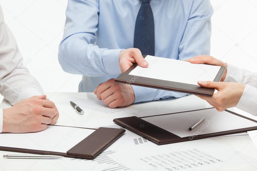 Businesspeople holding documents