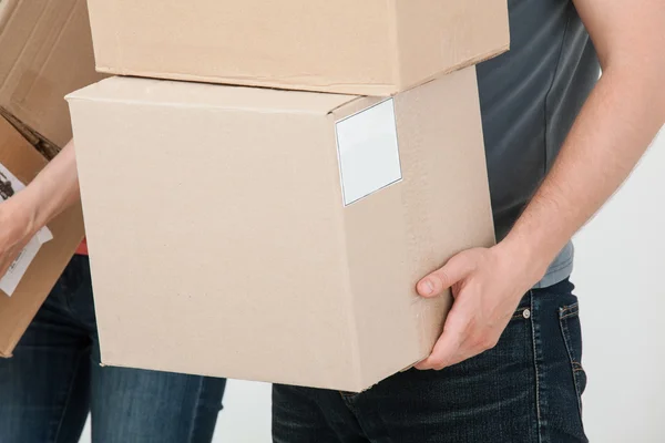 People carrying  cardboard boxes — Stock Photo, Image