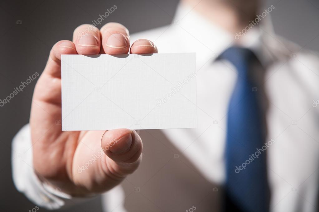 Businessman's hand showing visiting card