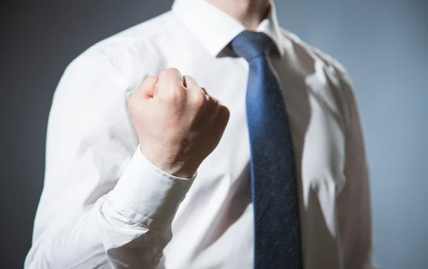 Businessman showing a strong fist — Stock Photo, Image