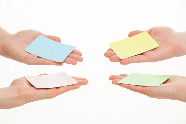 Hands reaching out paper cards — Stock Photo, Image