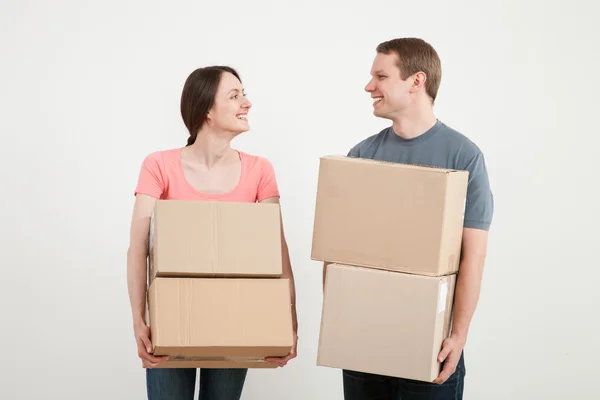 Man and woman holding cardboard boxes — Stock Photo, Image