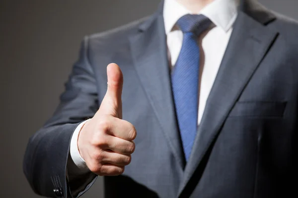 Businessman showing thumb up Royalty Free Stock Photos