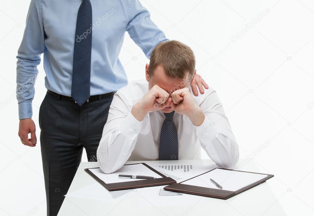 Businessman supporting his collegue in difficult situation