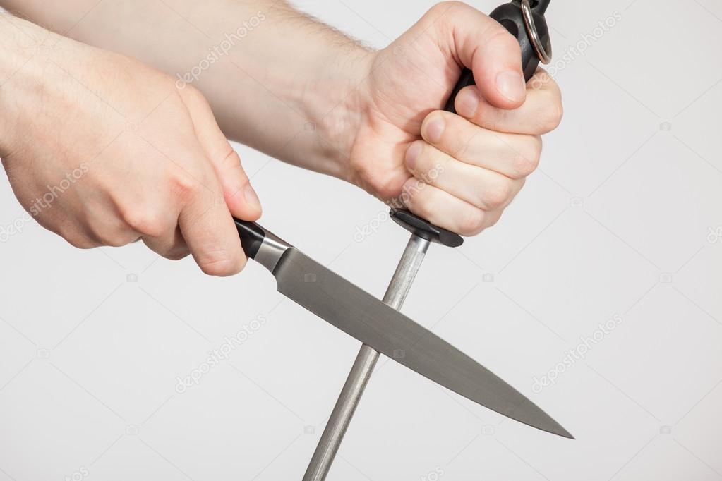 Man sharpening a large knif