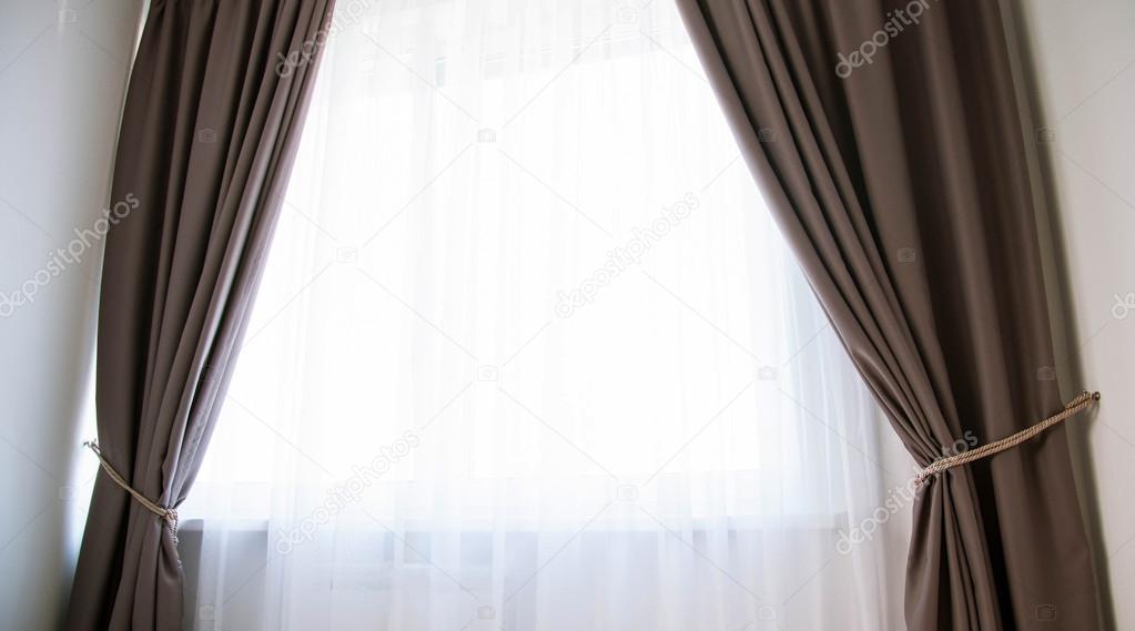 Window with brown curtains